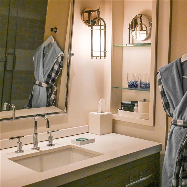 Bathroom with lots of counter space and inset shelving