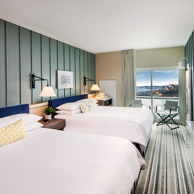 Two beds with a balcony